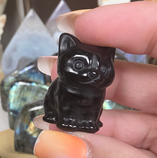 Obsidian cat carving